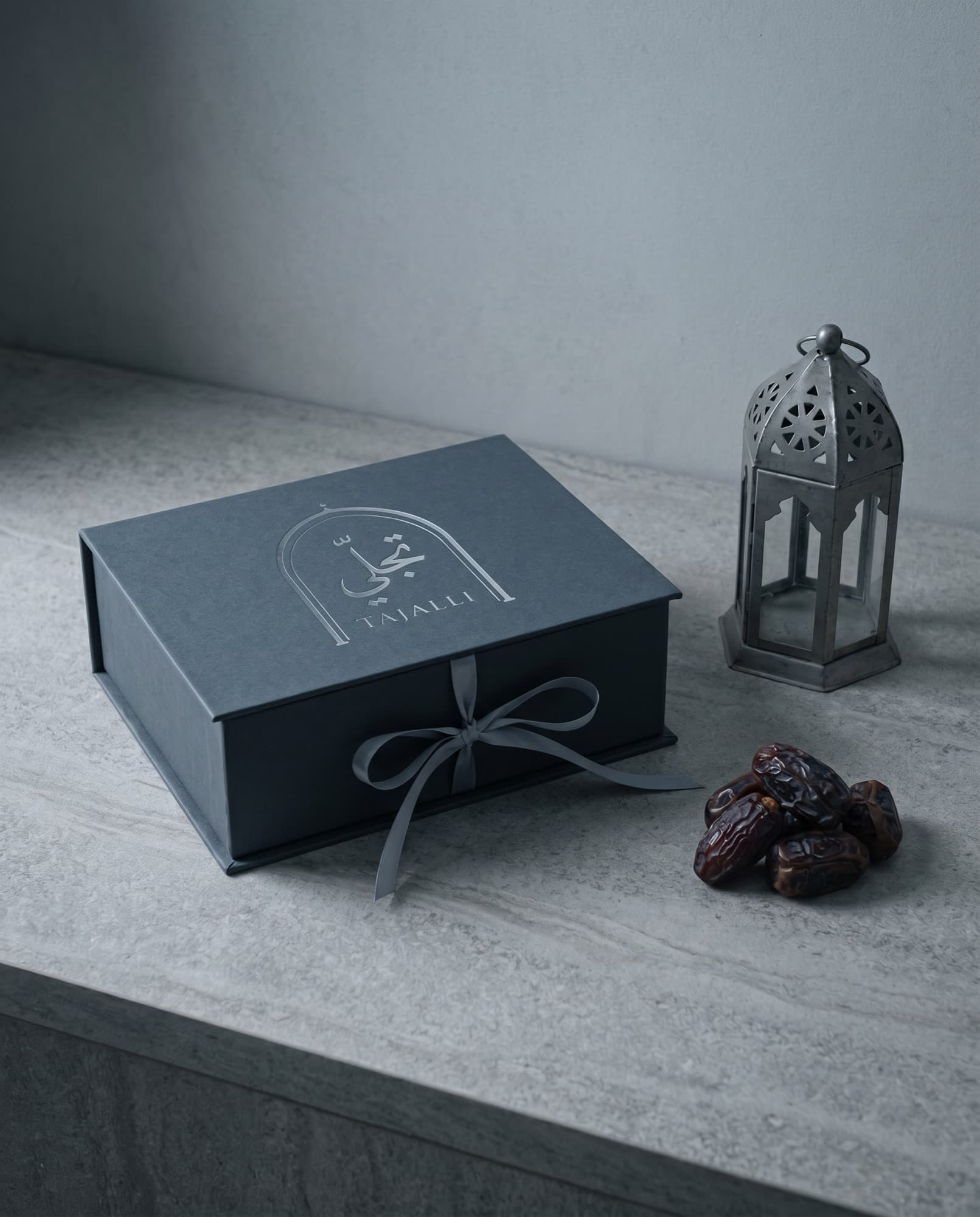 The gift-wrapped deck with a steel-grey ribbon